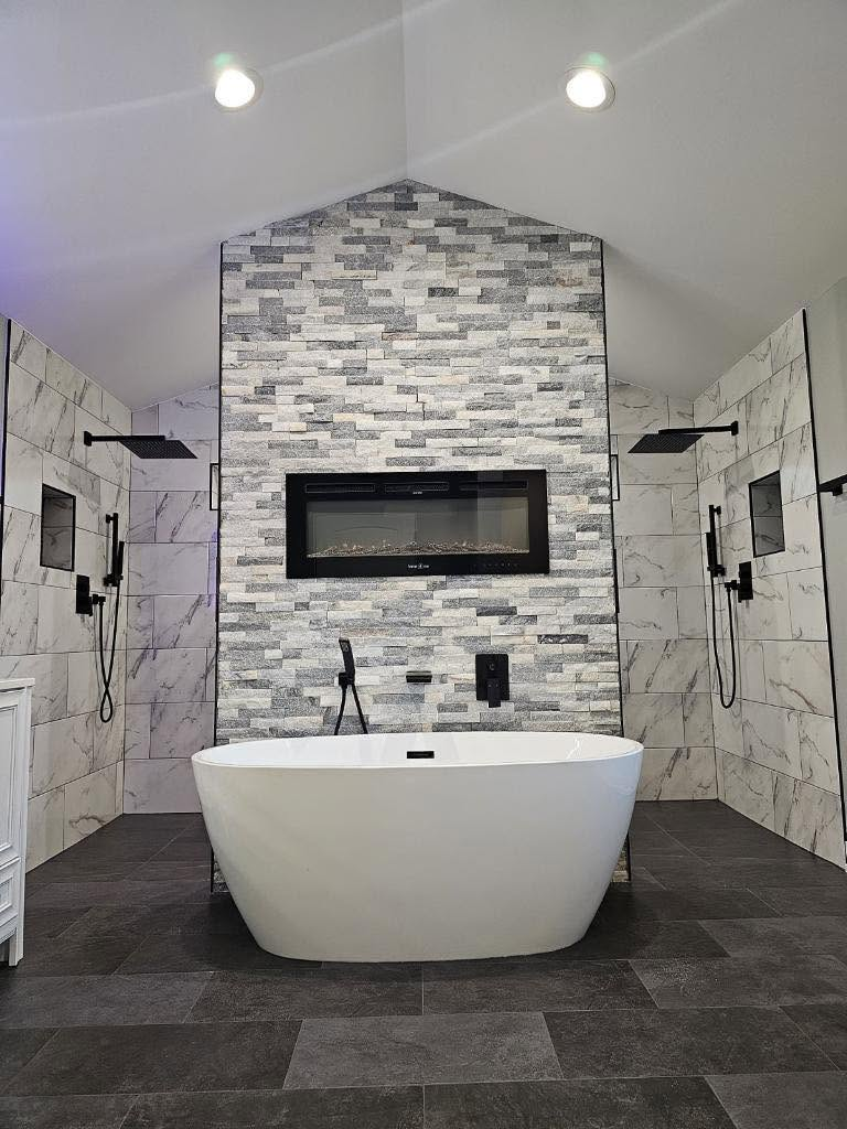 Bathroom with freestanding tub and tiled shower