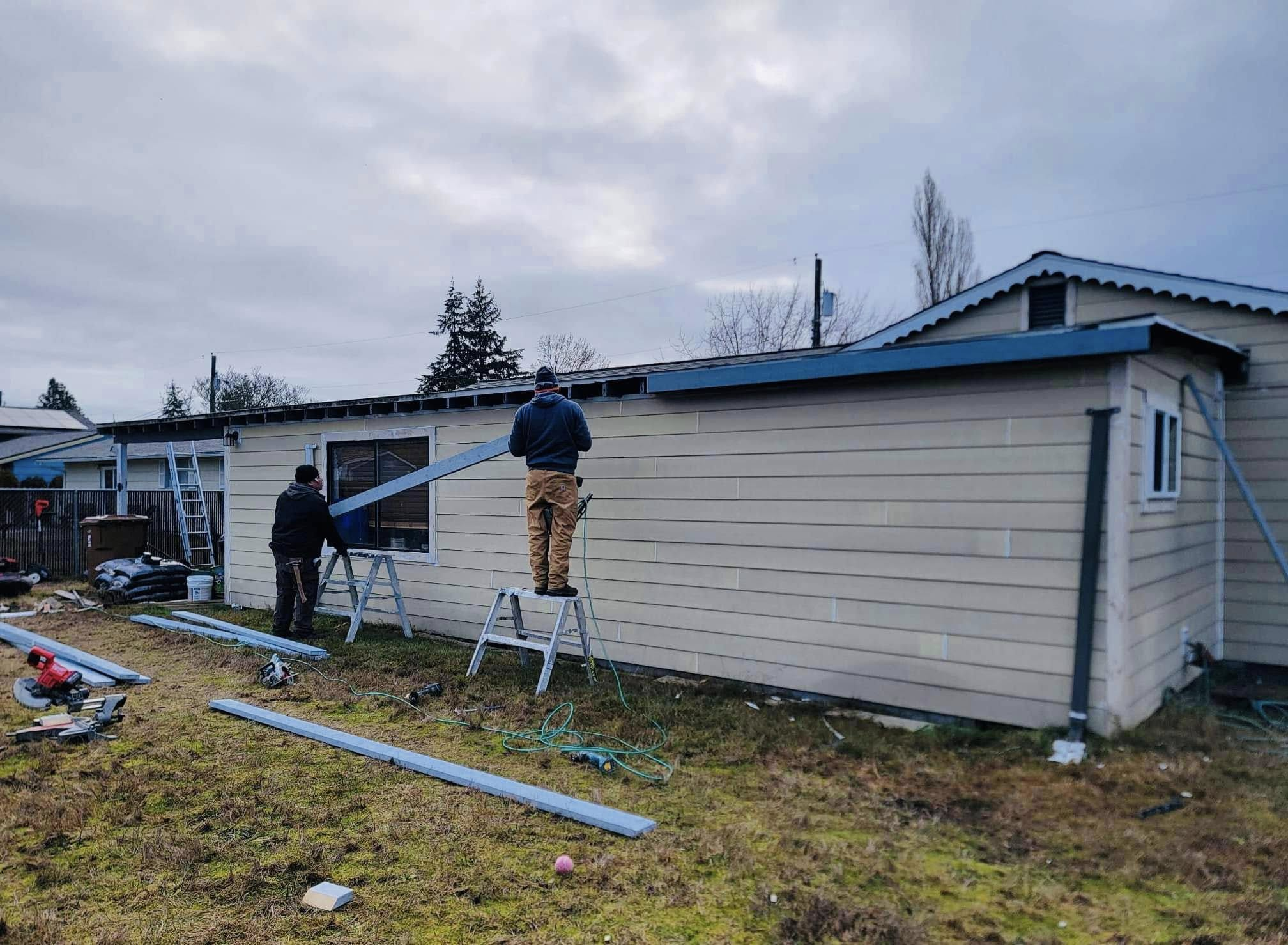 Corevia crew working on a home's exterior